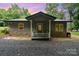 Charming home with stone accents, well-maintained landscaping, and welcoming front porch at 307 Lake Head Rd, Norwood, NC 28128