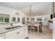 Open floor plan showcases the kitchen and dining area flowing into the living room, with natural light throughout at 307 Lake Head Rd, Norwood, NC 28128