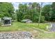 View of the exterior of the property with well-maintained lawn, shed, and driveway at 307 Lake Head Rd, Norwood, NC 28128