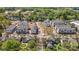 Lovely aerial view of new townhomes in a neighborhood featuring a central green space and tree-lined streets at 308 Catawba Ave, Davidson, NC 28036