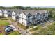 Exterior view of modern townhomes with attractive landscaping, sidewalks, and convenient parking at 308 Catawba Ave, Davidson, NC 28036