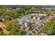 Aerial view of a white and gray townhome community surrounded by lush greenery at 312 Catawba Ave, Davidson, NC 28036