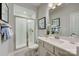 Bathroom featuring walk-in shower, modern sink, and updated fixtures at 312 Catawba Ave, Davidson, NC 28036