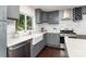 Modern kitchen with gray cabinetry, stainless steel appliances, white countertops, and a farmhouse sink at 3331 Eastwood Dr, Charlotte, NC 28205