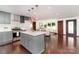 Spacious open floor plan of a kitchen featuring an island and stainless steel appliances at 3331 Eastwood Dr, Charlotte, NC 28205