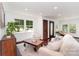 Bright living room with hardwood floors, a patterned rug, and comfortable seating near large windows at 3331 Eastwood Dr, Charlotte, NC 28205