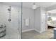 Bright bathroom features glass shower with a rain shower head and bathroom access to the bedroom at 3809 Topsfield Rd, Charlotte, NC 28211