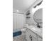 Bright bathroom with walk-in shower, granite countertops, patterned floors, and a round mirror at 3809 Topsfield Rd, Charlotte, NC 28211