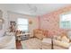 Bright Bedroom room with crib, floral wallpaper, ceiling fan, and hardwood floors at 3809 Topsfield Rd, Charlotte, NC 28211