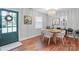 Cozy dining room features wood floors, stylish chandelier, and modern decor at 3809 Topsfield Rd, Charlotte, NC 28211