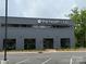 Exterior view of a fitness center with large windows and ample parking at 3809 Topsfield Rd, Charlotte, NC 28211