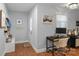 Foyer features a small office nook, coat rack, and hardwood floors at 3809 Topsfield Rd, Charlotte, NC 28211