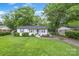 Charming one-story home featuring a well-manicured lawn and tidy landscaping at 3809 Topsfield Rd, Charlotte, NC 28211