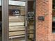 Verdant storefront with visible hours, rustic brick, and bright storefront details at 3809 Topsfield Rd, Charlotte, NC 28211