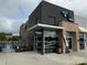 The Teal Turnip storefront featuring modern architecture, outdoor seating, and natural light at 3809 Topsfield Rd, Charlotte, NC 28211