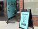 Exterior entrance of The Accidental Baker, showcasing charming signage and a welcoming atmosphere at 3809 Topsfield Rd, Charlotte, NC 28211