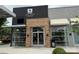 Night Swim Coffee storefront with modern design, brick facade, and inviting glass doors at 3809 Topsfield Rd, Charlotte, NC 28211