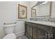 Quaint bathroom showcasing stained glass window, detailed vanity and decorative mirror at 402 W 8Th St, Charlotte, NC 28202