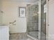 Updated bathroom with a glass shower enclosure and decorative glass block window at 402 W 8Th St, Charlotte, NC 28202