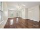 Bright bedroom featuring hardwood floors, double closets, and two large bright windows at 402 W 8Th St, Charlotte, NC 28202