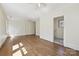 Versatile bonus room with hardwood floors, offering potential for a home office or entertainment space at 402 W 8Th St, Charlotte, NC 28202