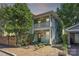 Charming two-story home with inviting front porch, lovely brickwork, and mature trees at 402 W 8Th St, Charlotte, NC 28202