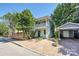 Charming two-story home with brick driveway, manicured landscaping, and detached garage at 402 W 8Th St, Charlotte, NC 28202