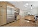 Stylish kitchen featuring stainless steel appliances, wood cabinets, hardwood floors, and ample counter space at 402 W 8Th St, Charlotte, NC 28202