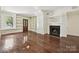 Large living room with hardwood floors, fireplace, and built-in bookshelves at 402 W 8Th St, Charlotte, NC 28202