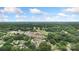 Expansive aerial view of a neighborhood nestled among lush green trees and a well-manicured golf course at 418 Link St, Fort Mill, SC 29715