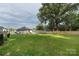 The spacious backyard features new fencing, a wooden deck, and convenient parking at 418 Link St, Fort Mill, SC 29715