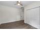 Bright bedroom with closet, dark floors, and neutral paint at 418 Link St, Fort Mill, SC 29715
