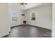 Cozy bedroom with a ceiling fan, fireplace, and hardwood floors offering a comfortable retreat at 418 Link St, Fort Mill, SC 29715