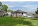 Home exterior featuring a manicured lawn, new wood deck, and convenient covered parking at 418 Link St, Fort Mill, SC 29715