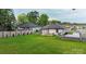 Home exterior showcasing a spacious yard, new deck, wood fence, and parking at 418 Link St, Fort Mill, SC 29715