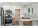 Beautiful kitchen with modern stainless-steel appliances, granite countertops, and convenient access to the laundry at 418 Link St, Fort Mill, SC 29715