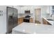 The updated kitchen has stainless appliances, modern countertops, and ample storage in the white cabinets at 418 Link St, Fort Mill, SC 29715