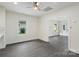 Bright living space featuring sleek flooring, white walls, and lots of natural light from the many windows at 418 Link St, Fort Mill, SC 29715
