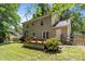 This home features a backyard view with a wood deck and outdoor access at 4232 Saint Audrey Pl, Charlotte, NC 28269