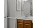 Cozy bathroom with wooden vanity, updated hardware and tiled shower at 4232 Saint Audrey Pl, Charlotte, NC 28269