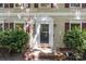 Close-up of the home's entrance, featuring a classic front door and well-maintained landscaping at 4232 Saint Audrey Pl, Charlotte, NC 28269