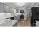Updated kitchen with light gray cabinets, subway tile backsplash and stainless steel appliances at 4232 Saint Audrey Pl, Charlotte, NC 28269