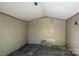 An image of the interior of a shed, with white paneling and flooring at 4232 Saint Audrey Pl, Charlotte, NC 28269