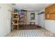 Storage shed interior includes lighting, linoleum flooring, and access ladder to loft at 4232 Saint Audrey Pl, Charlotte, NC 28269