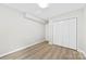 Bedroom features wood-look flooring, closet space, and neutral walls, ready for your personal touch at 430 Queens Rd # 332, Charlotte, NC 28207