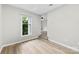 Bright bedroom featuring light wood flooring and an entry way to another space at 430 Queens Rd # 332, Charlotte, NC 28207