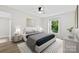 Cozy bedroom featuring a large bed, stylish rug, and lots of natural light at 430 Queens Rd # 332, Charlotte, NC 28207