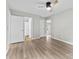 Spacious bedroom with modern ceiling fan, light wood flooring, and multiple entrances at 430 Queens Rd # 332, Charlotte, NC 28207