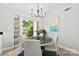 Charming dining room with natural light, built-in shelving, and a round table perfect for intimate gatherings at 430 Queens Rd # 332, Charlotte, NC 28207