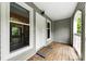 A covered front porch includes a 'welcome' mat at 430 Queens Rd # 332, Charlotte, NC 28207